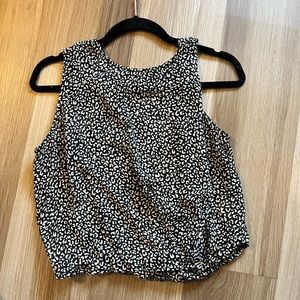 Leopard print black and white blouse with an opening on the back.